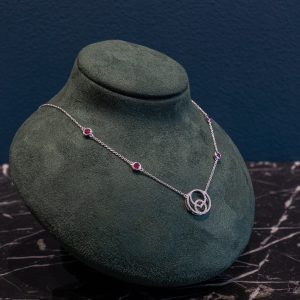 18 Carat White Gold Diamond and Ruby Studded Insignia Necklace